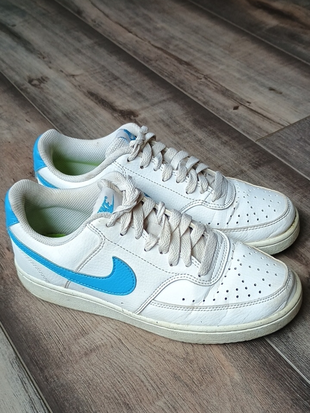 Nike White Low-Top Sneakers with Blue Swoosh